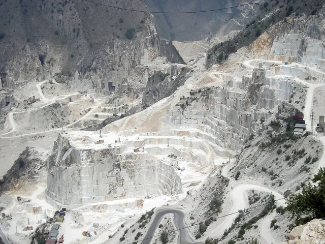 Vast Carrara Marble Quarries showing terraced cuts in the mountain.